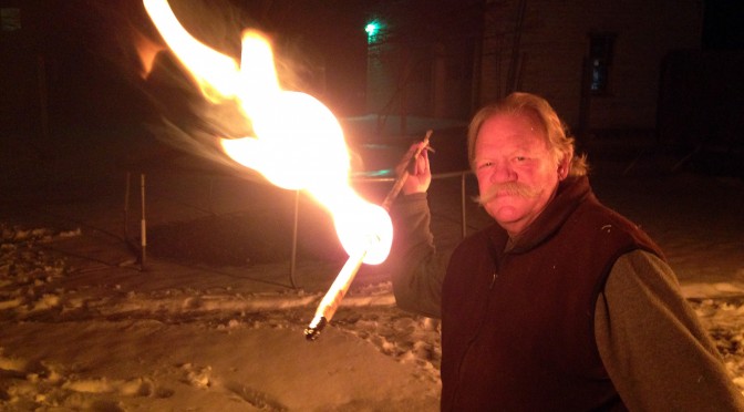 Throwing a flaming atlatl dart for Winter Solstice